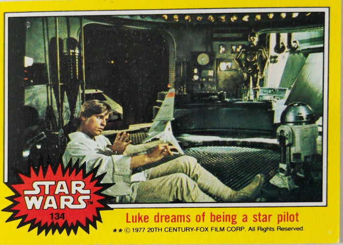 1977 Topps Star Wars trading card featuring Luke Skywalker dreaming of becoming a star pilot with droids in background