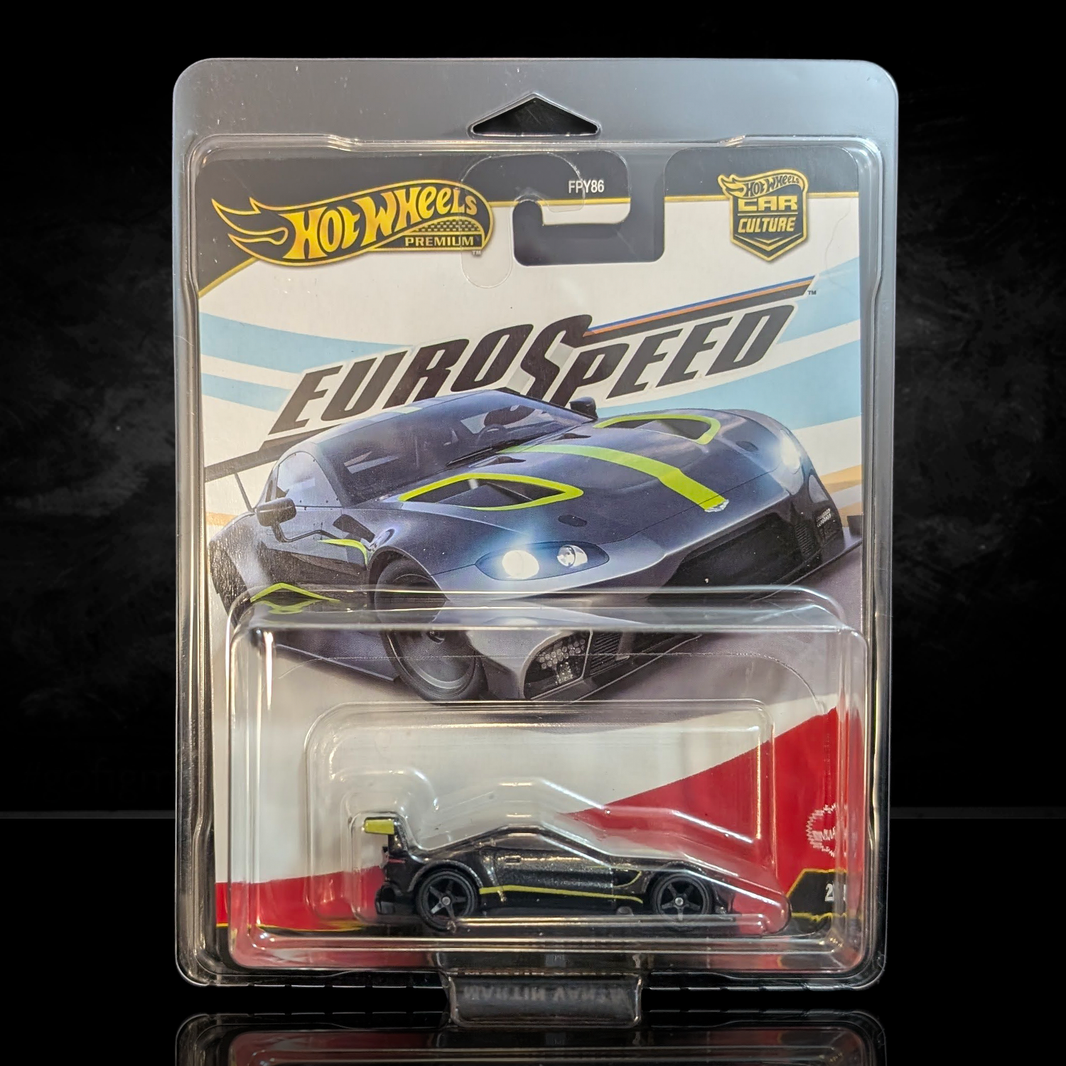 Hot Wheels Premium Euro Speed die-cast car in black with yellow accents and detailed Real Riders wheels in collector packaging