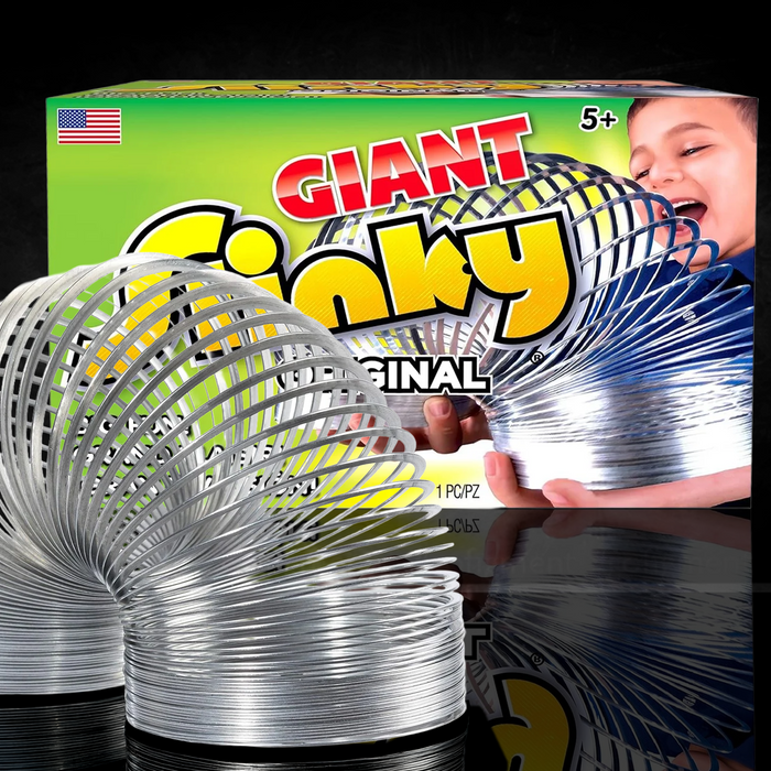 Giant Metal Slinky by Just Play showing a large metal coil toy in front of its colorful packaging with a child playing.