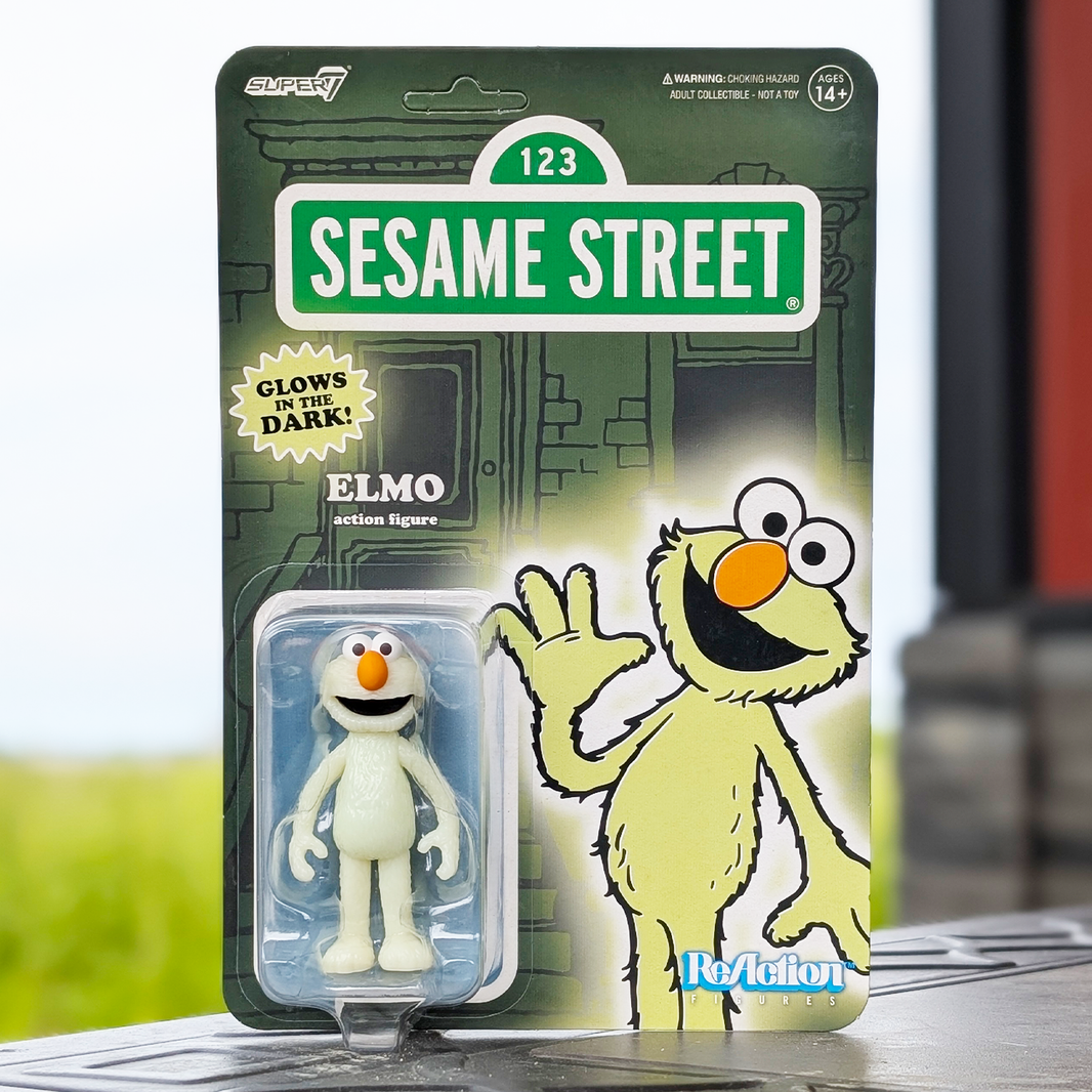 Elmo Glow ReAction Figure Exclusive – Sesame Street 3.75" Super7 Collectible new in box with glow-in-the-dark feature