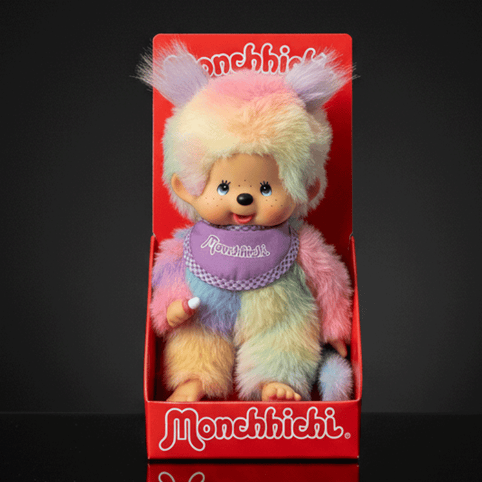 Sekiguchi 8-inch Monchhichi girl doll in pastel tie-dye plush seated in red branded display box