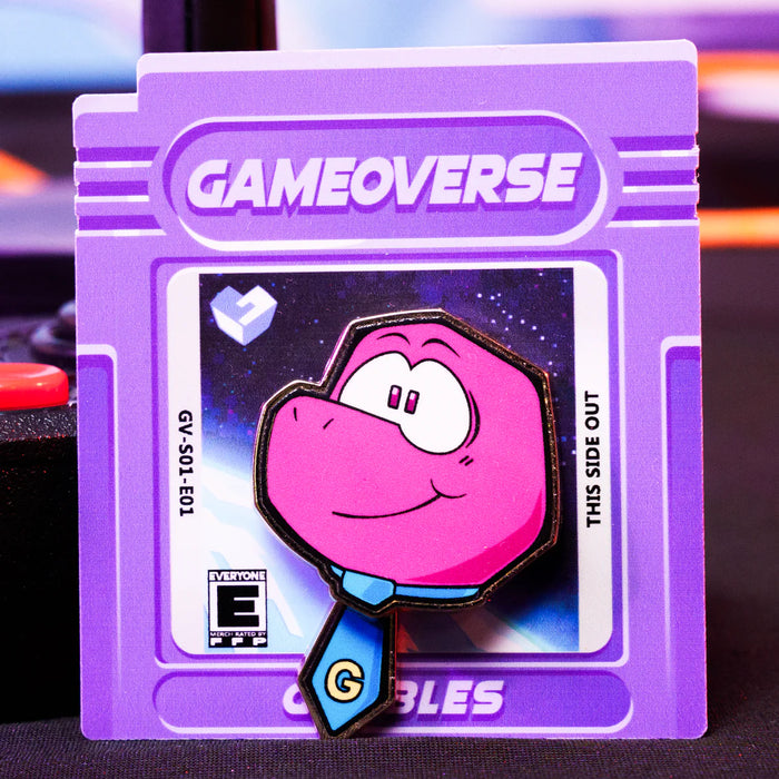 Gobbles Pin – Gameoverse Glitch Productions Enamel Collectible featuring pink character with blue tie on purple game cartridge card by Glitch new loose pin