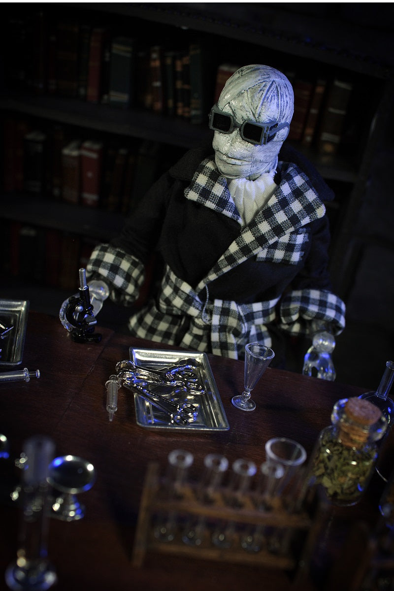 The Invisible Man Retro Style Articulated Mego Action Figure 8 inch dressed in plaid robe with scientific tools on table