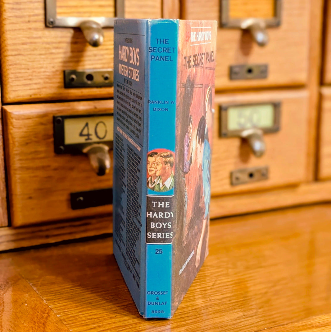 Vintage Hardy Boys book The Secret Panel 25 by Grosset & Dunlap with blue spine and illustrated cover
