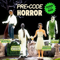 Set of four Super7 Pre-Code Horror glow-in-the-dark figures from Chamber of Chills with spooky graveyard backdrop