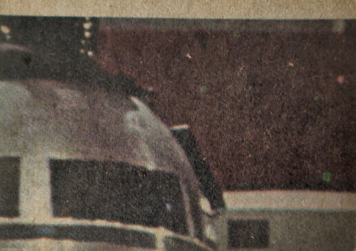Close-up of 1977 Topps Star Wars Trading Card showing partial image of a droid head from Yellow Series 3 set