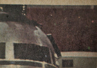 Close-up of 1977 Topps Star Wars Trading Card showing partial image of a droid head from Yellow Series 3 set