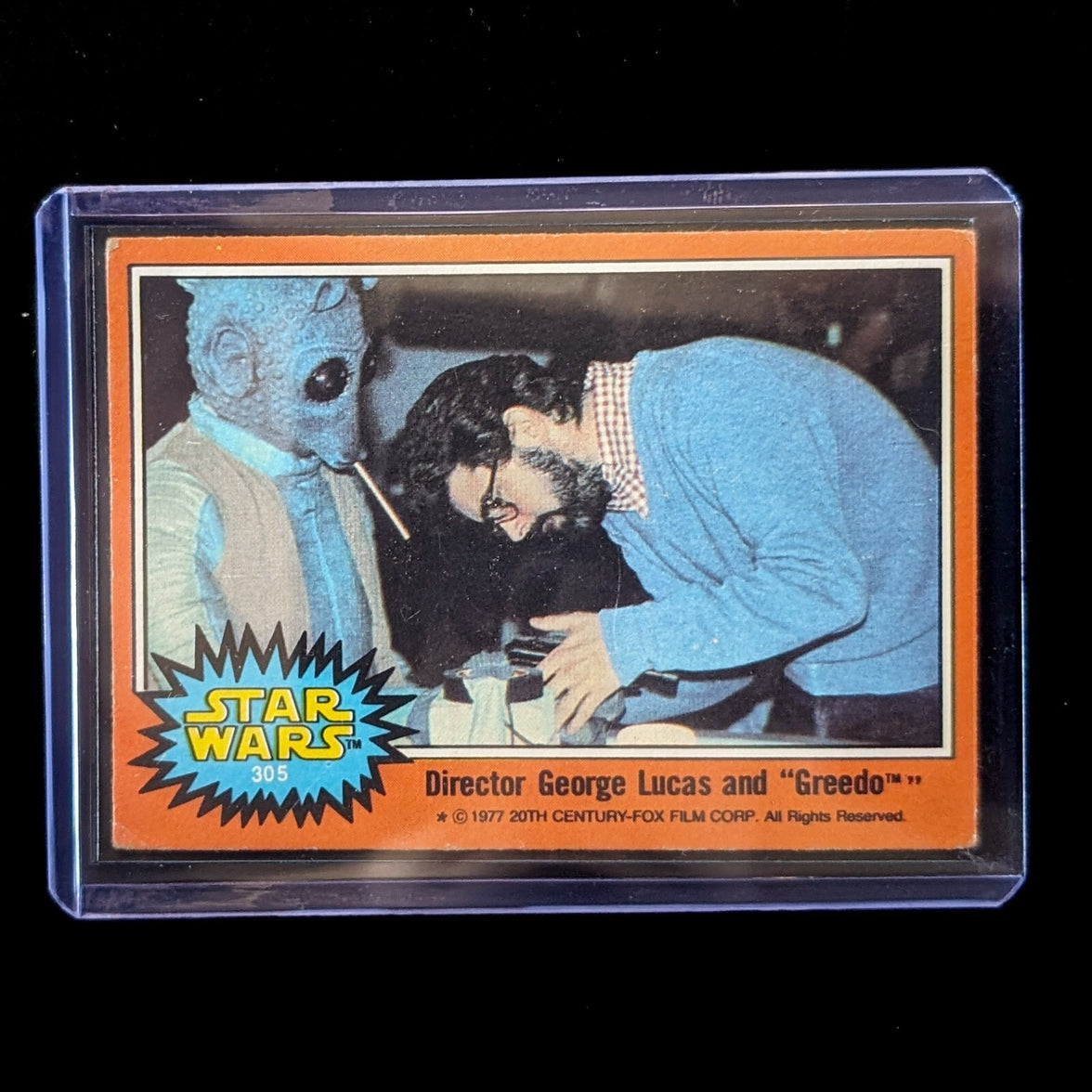 1977 TOPPS STAR WARS Orange Series 4 trading card of George Lucas directing Greedo in protective plastic case by Go Figment