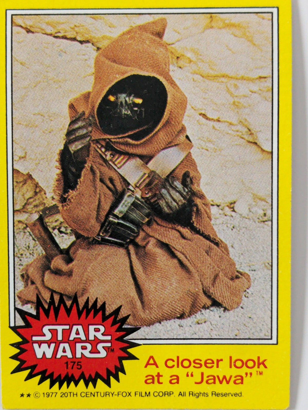 1977 Topps Star Wars yellow Series 3 trading card featuring Jawa character on sandy background