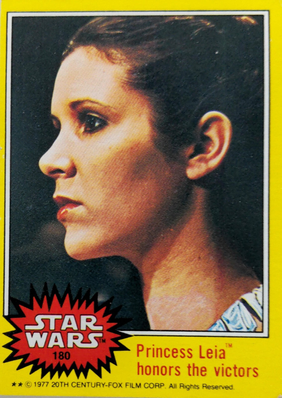 1977 Topps Star Wars trading card 180 Princess Leia honors the victors yellow Series 3 border close-up profile