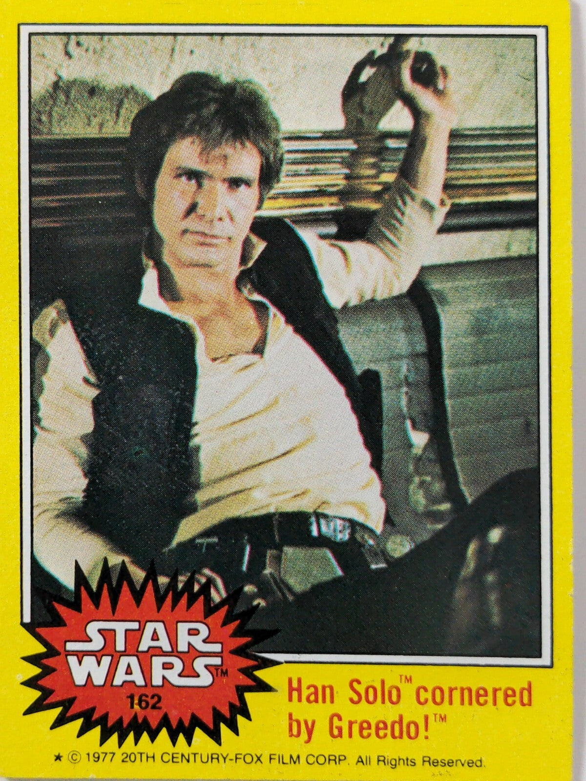 1977 Topps Star Wars trading card featuring Han Solo cornered by Greedo with yellow border Series 3