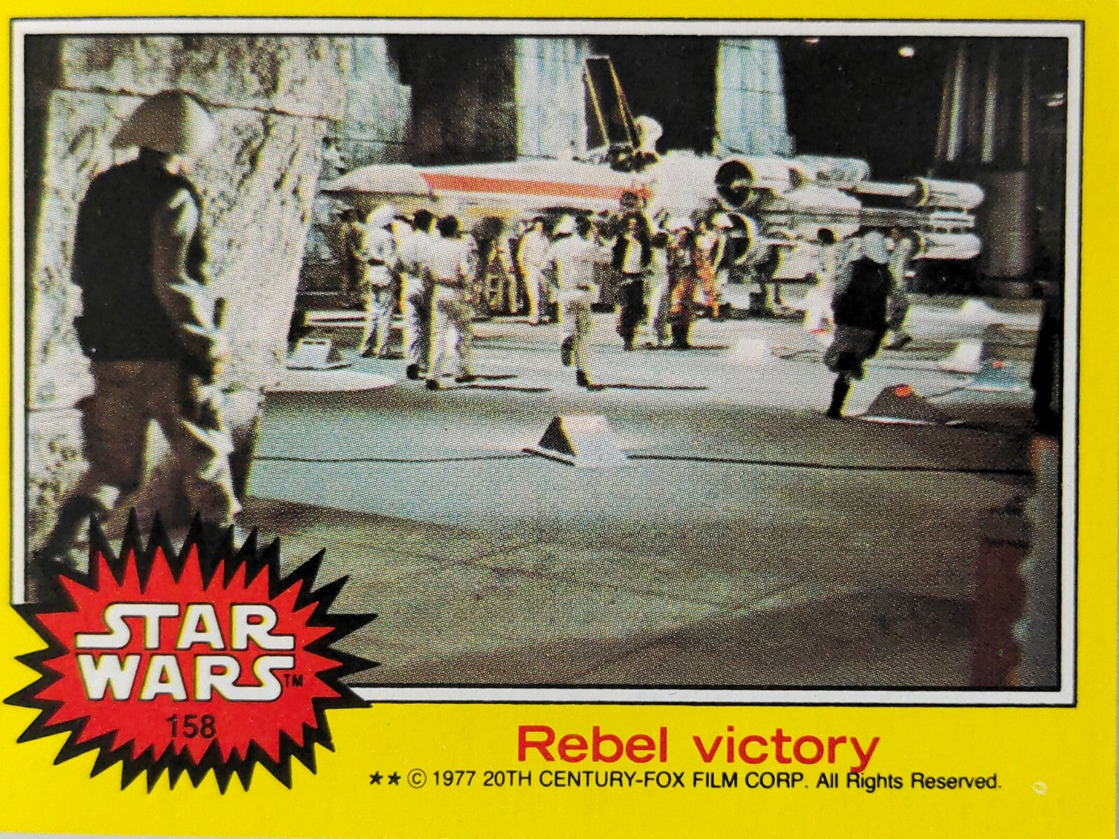 1977 Topps Star Wars trading card number 158 Rebel victory scene from original movie series 3 yellow border