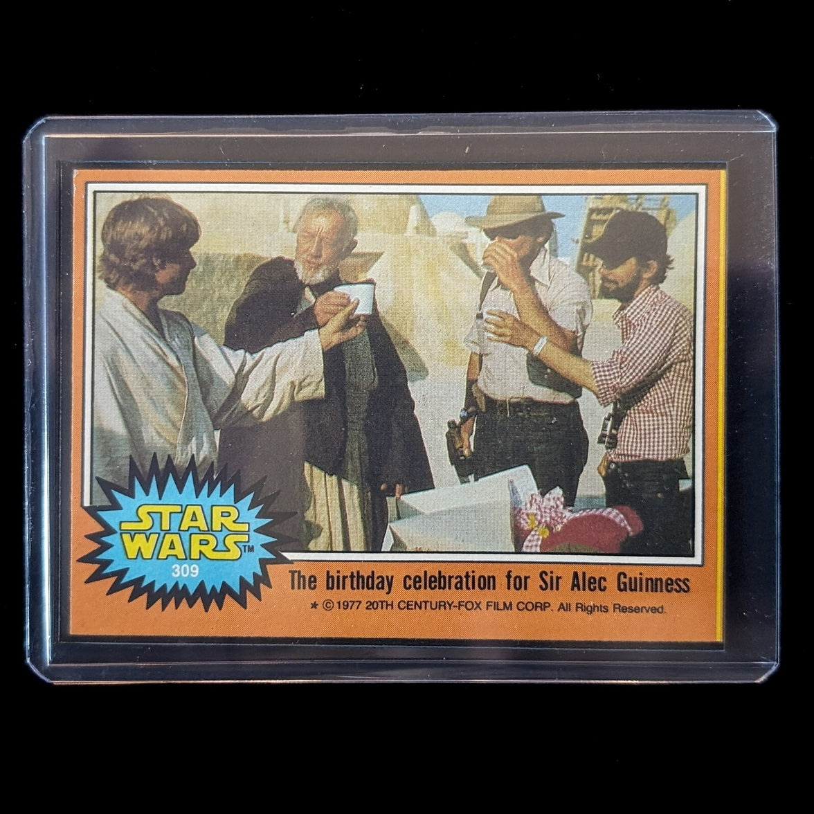 1977 Topps Star Wars Trading Card 309 birthday celebration for Sir Alec Guinness encased by Go Figment