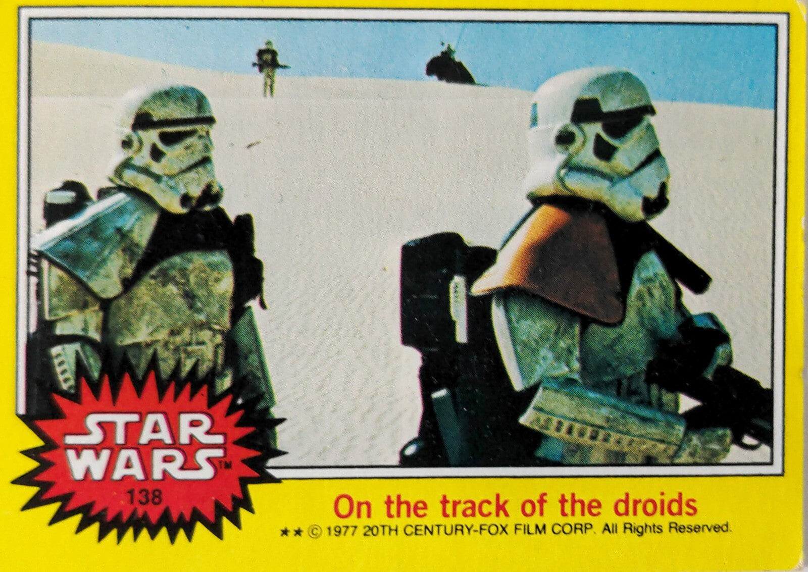 1977 Topps Star Wars trading card featuring two stormtroopers in desert with "On the track of the droids" text