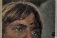 Close-up of 1977 Topps Star Wars YELLOW Series 3 trading card featuring Luke Skywalker face detail