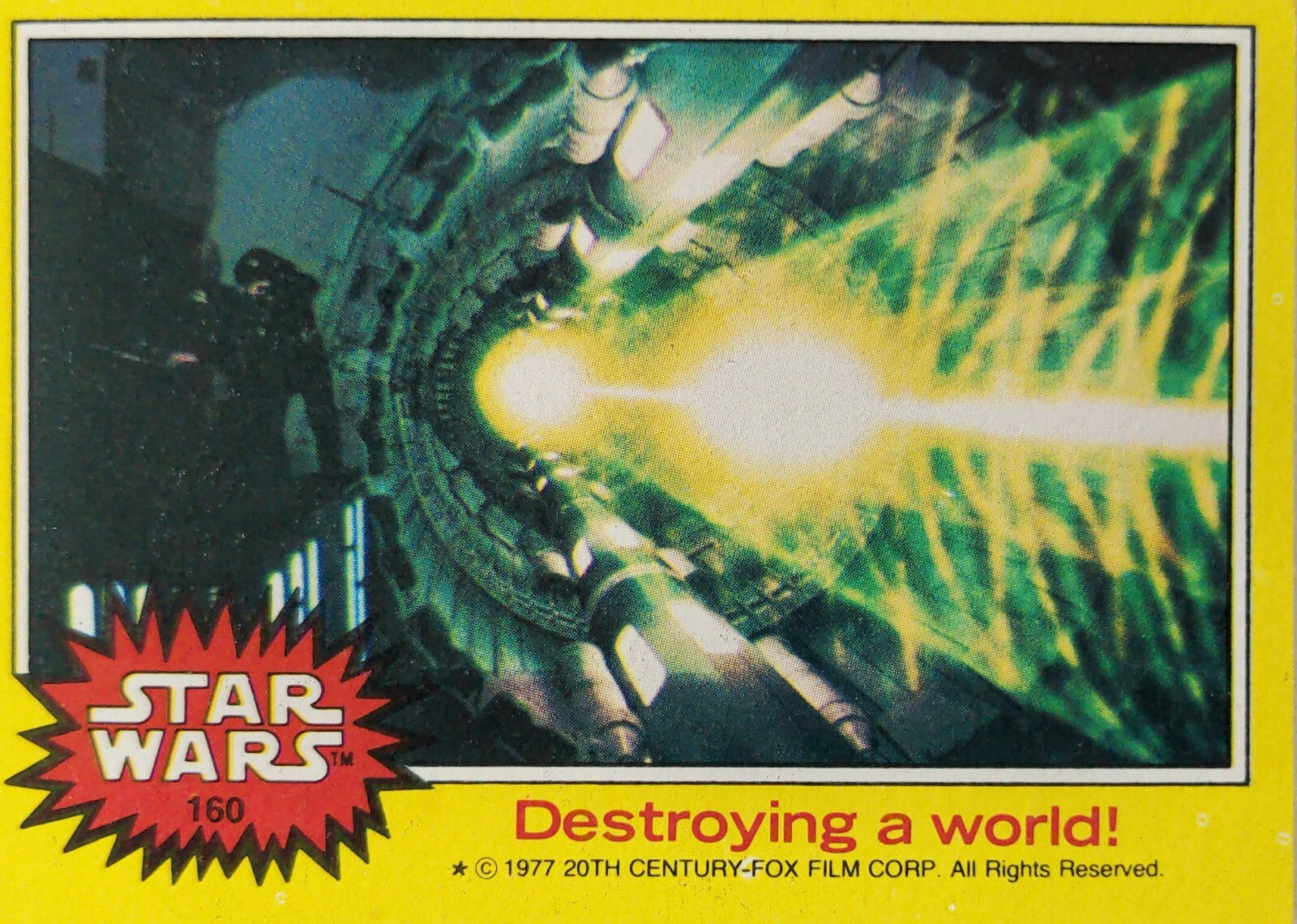 1977 Topps Star Wars Trading Card series 3 yellow border featuring Death Star laser firing scene Destroying a world