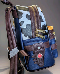 Side view of Loungefly Toy Story mini backpack with cow print, brown straps, and sheriff badge detail