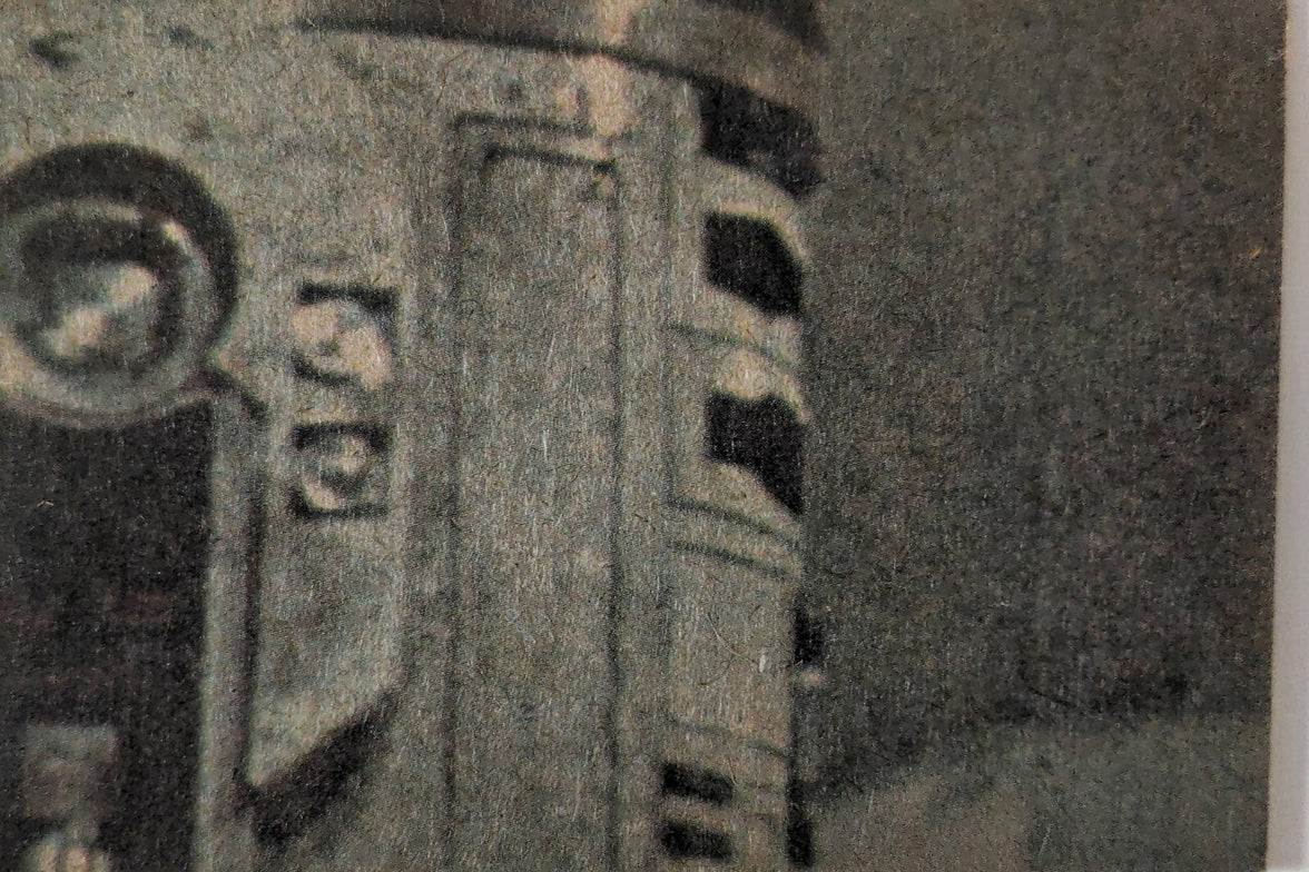 Close-up of 1977 Topps Star Wars Yellow Series 3 trading card featuring droid details on textured card surface