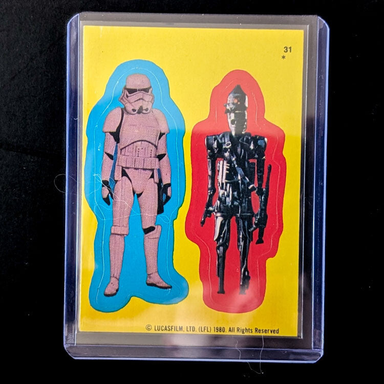1980 TOPPS Empire Strikes Back vintage sticker featuring Stormtrooper and droid in protective case by Go Figment
