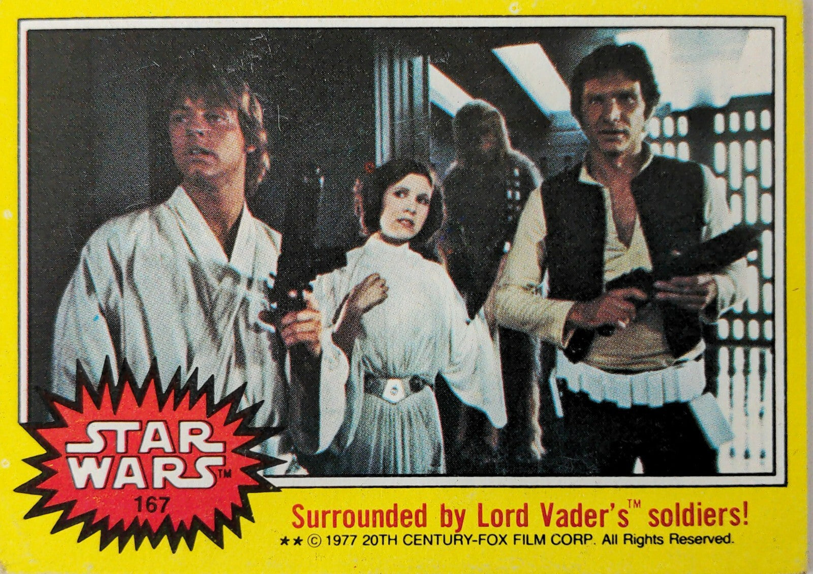 1977 Topps Star Wars yellow series 3 trading card featuring Luke Skywalker, Princess Leia, and Han Solo