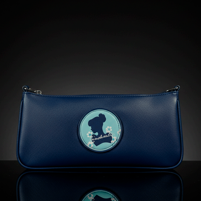 Danielle navy blue baguette bag with Cinderella silhouette and floral accents on round patch in center front