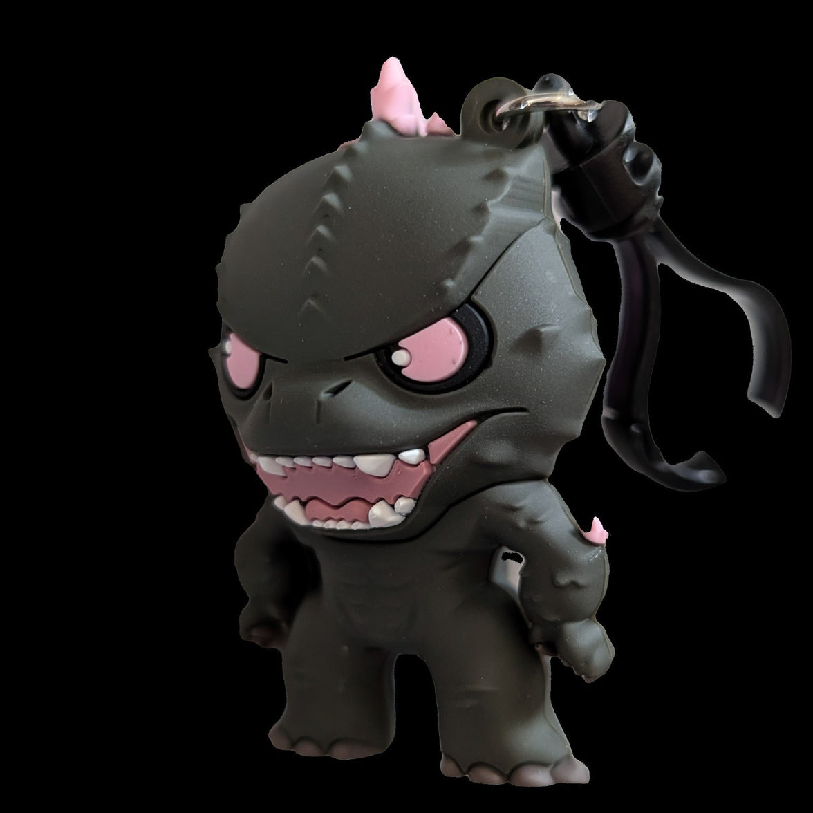 3D foam Godzilla keychain from Monogram with fierce expression and pink accents, inspired by New Empire movie.