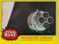 1977 Topps Star Wars trading card 155 showing The Escape Pod jettisoned in space on yellow Series 3 background