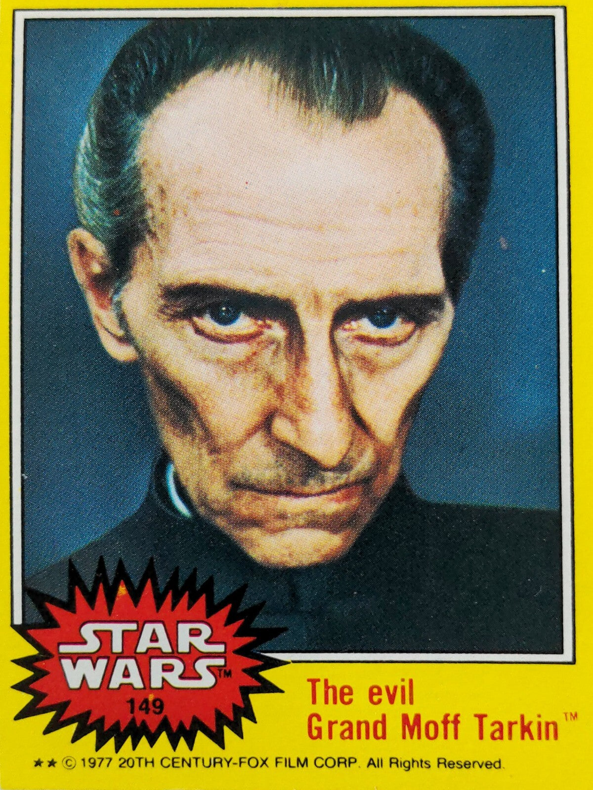 1977 Topps Star Wars trading card featuring close-up portrait of Grand Moff Tarkin with yellow border