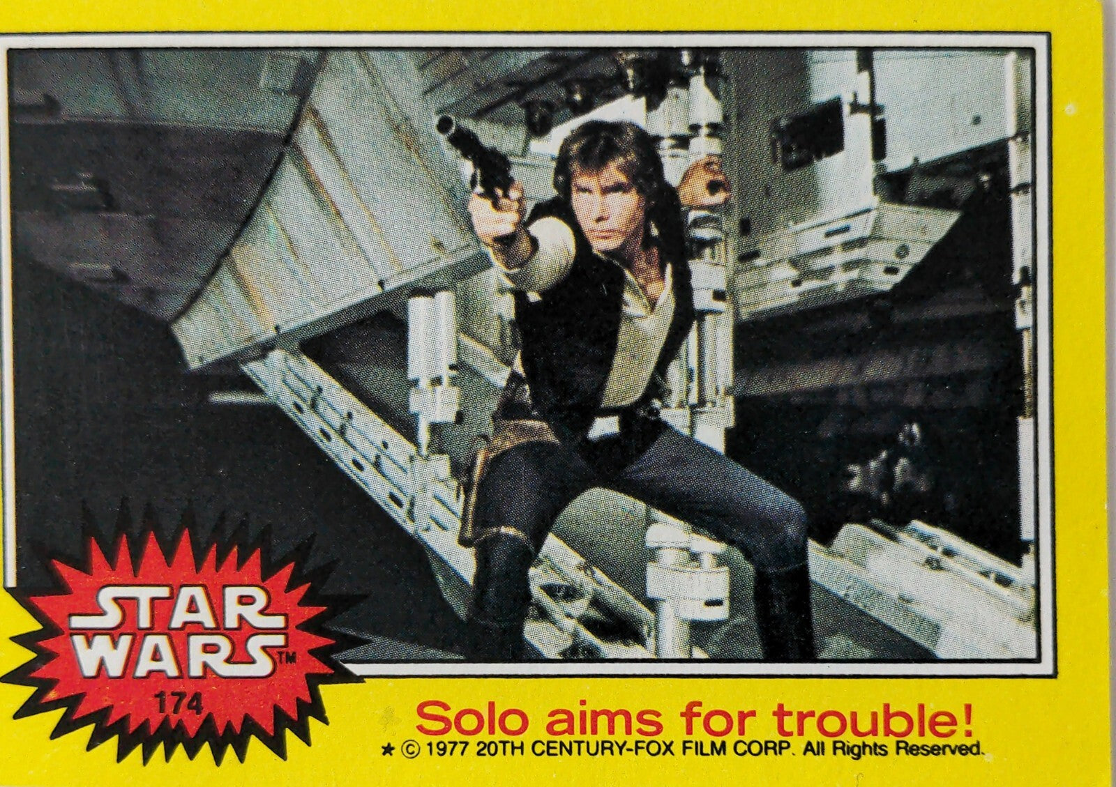 1977 Topps Star Wars card featuring Han Solo aiming blaster in yellow Series 3 trading card design