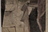 Close-up of vintage 1977 Topps Star Wars yellow Series 3 trading card corner with textured background