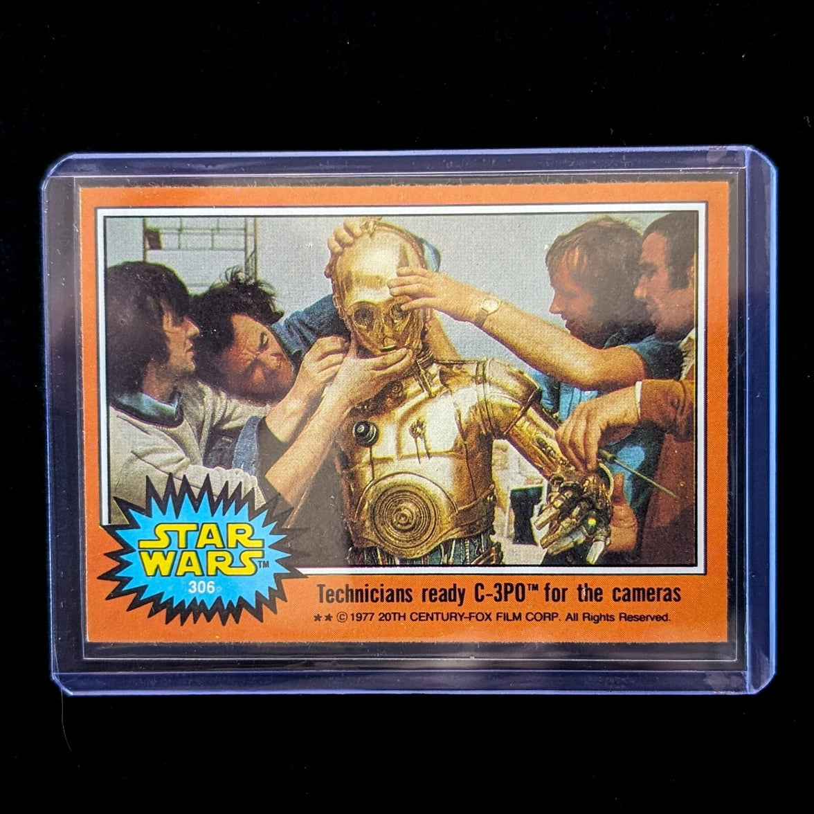 1977 Go Figment Topps Star Wars Orange Series 4 card showing technicians adjusting C-3PO on set numbered 306