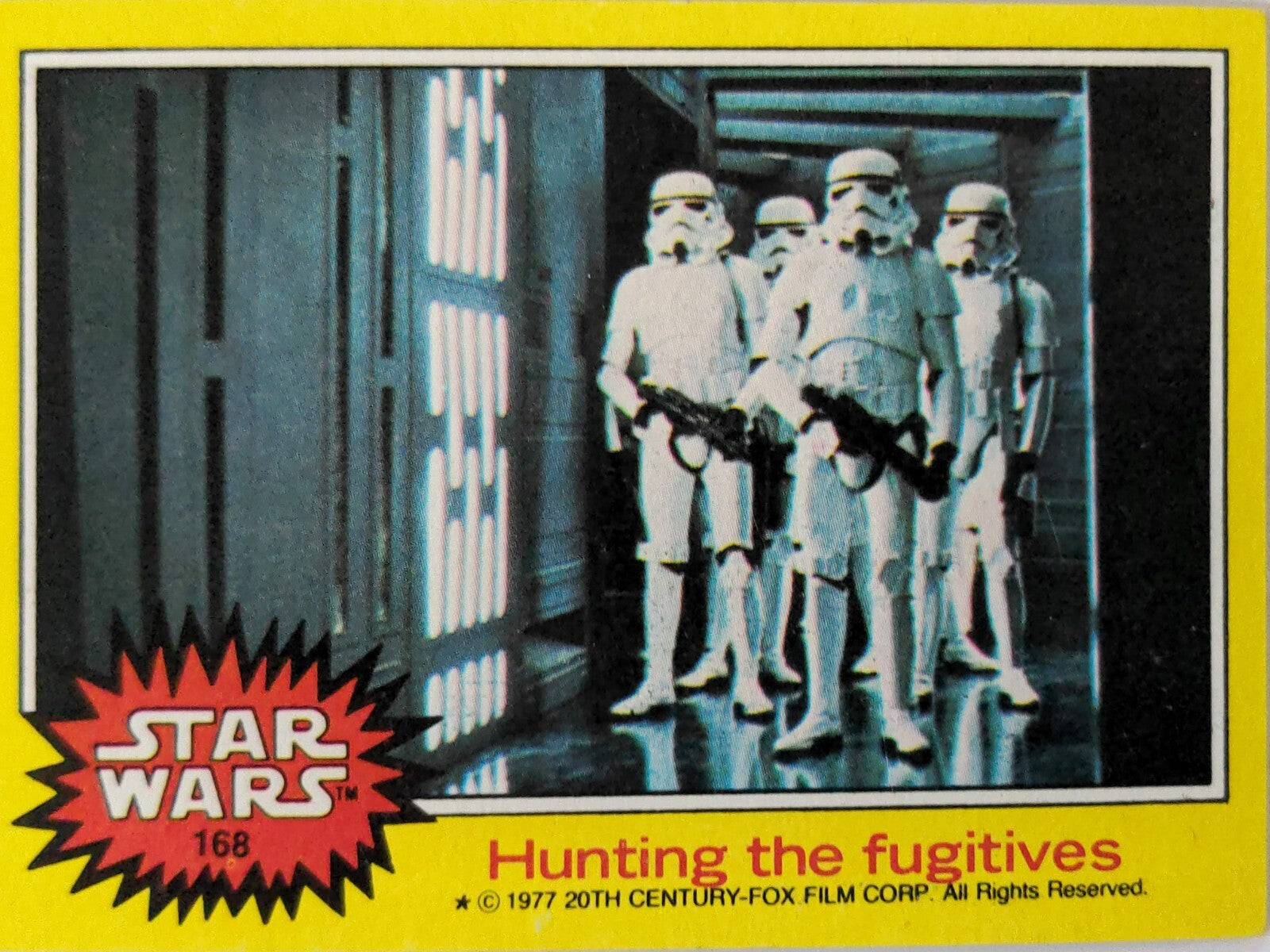 1977 Topps Star Wars trading card featuring stormtroopers titled Hunting the fugitives from yellow Series 3