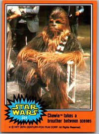 1977 Go Figment Topps Star Wars Orange Series 4 trading card of Chewbacca resting on chair between scenes