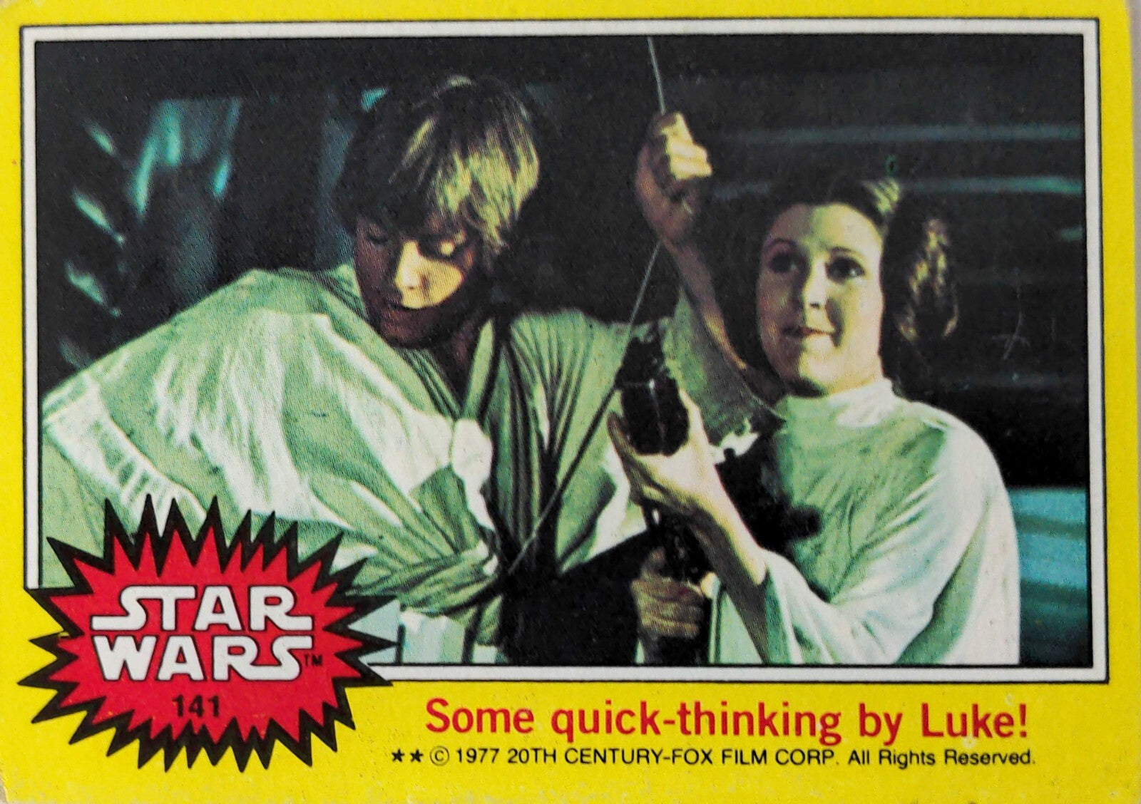 1977 Topps Star Wars trading card featuring Luke Skywalker and Princess Leia with yellow border and logo