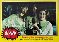 1977 Topps Star Wars trading card featuring Luke Skywalker and Princess Leia with yellow border and logo
