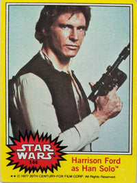 1977 Topps Star Wars trading card featuring Harrison Ford as Han Solo with blaster and yellow border