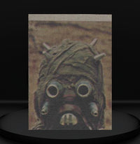 Close-up of vintage 1977 Topps Star Wars trading card featuring a Tusken Raider from Go Figment collection.
