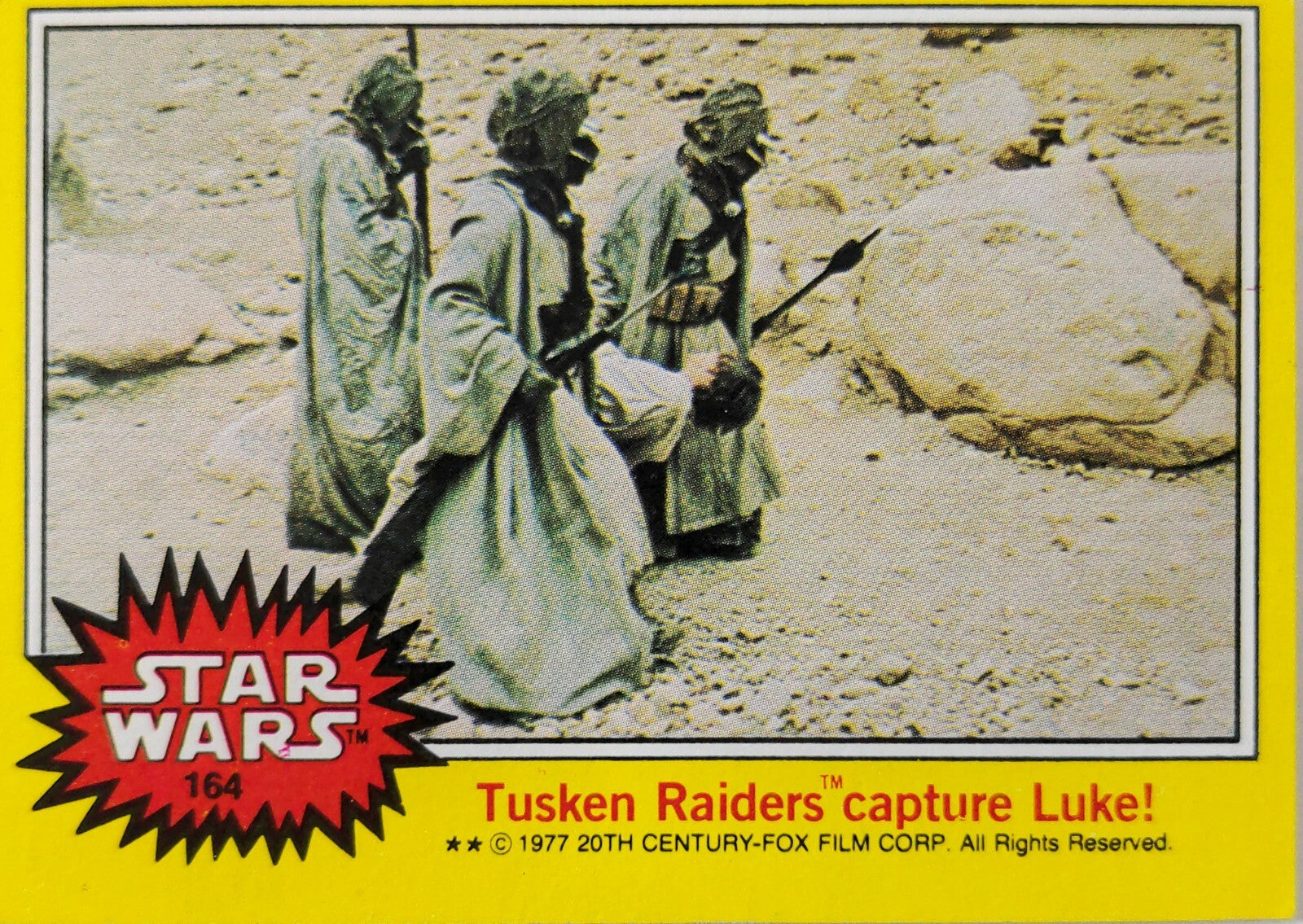 1977 Topps Star Wars yellow Series 3 trading card 164 Tusken Raiders capture Luke scene