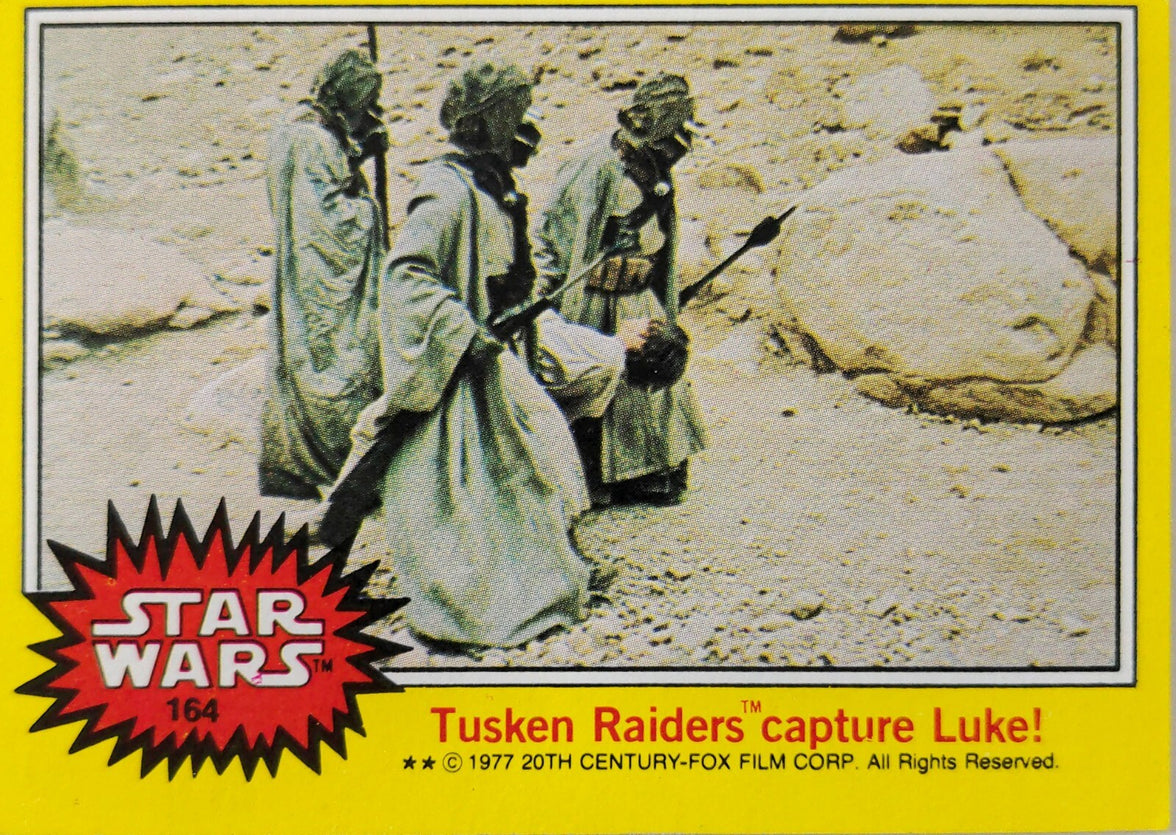 1977 Topps Star Wars yellow Series 3 trading card 164 Tusken Raiders capture Luke scene