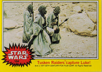 1977 Topps Star Wars yellow Series 3 trading card 164 Tusken Raiders capture Luke scene