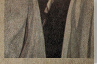Close-up of vintage 1977 Topps Star Wars trading card edge showing textured paper and partial figure sleeve