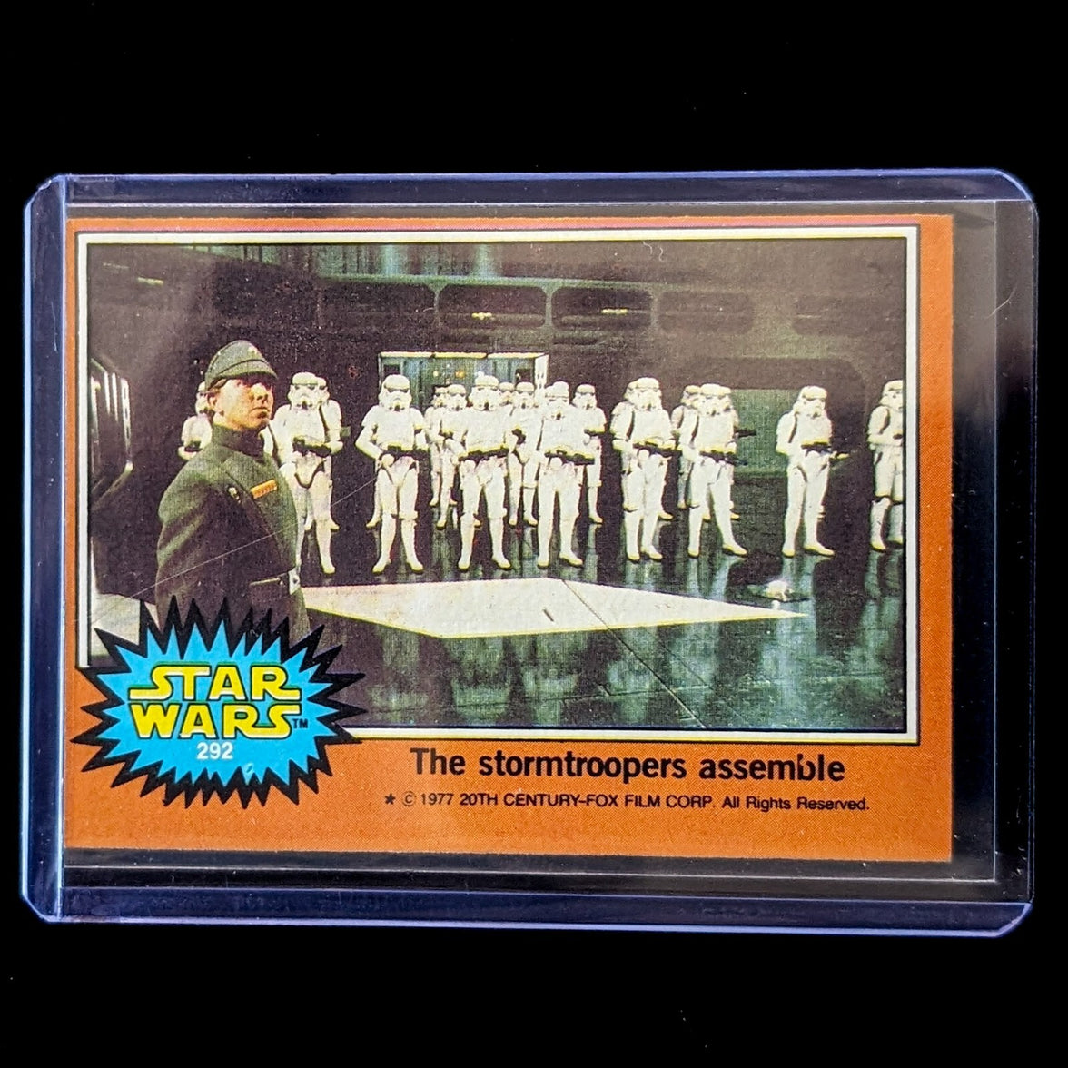 1977 Go Figment TOPPS Star Wars Orange Series 4 card featuring stormtroopers assemble scene in protective sleeve