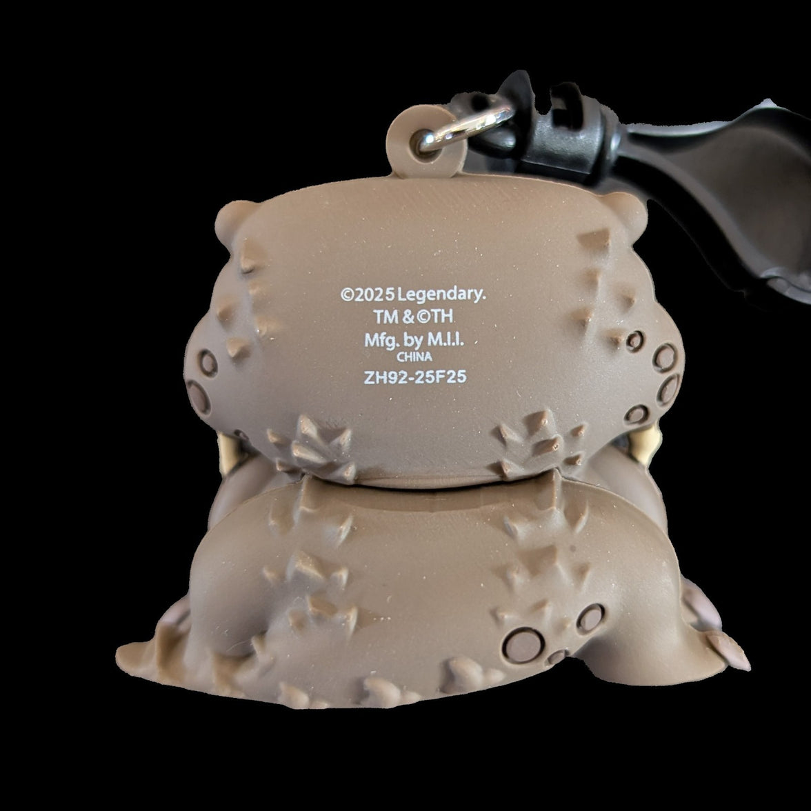 Back view of Doug Godzilla-Kong New Empire 3D foam bag clip keychain by Monogram with manufacturing details visible