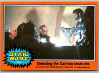 1977 Go Figment TOPPS Star Wars card 308 Directing the Cantina creatures with vintage orange border