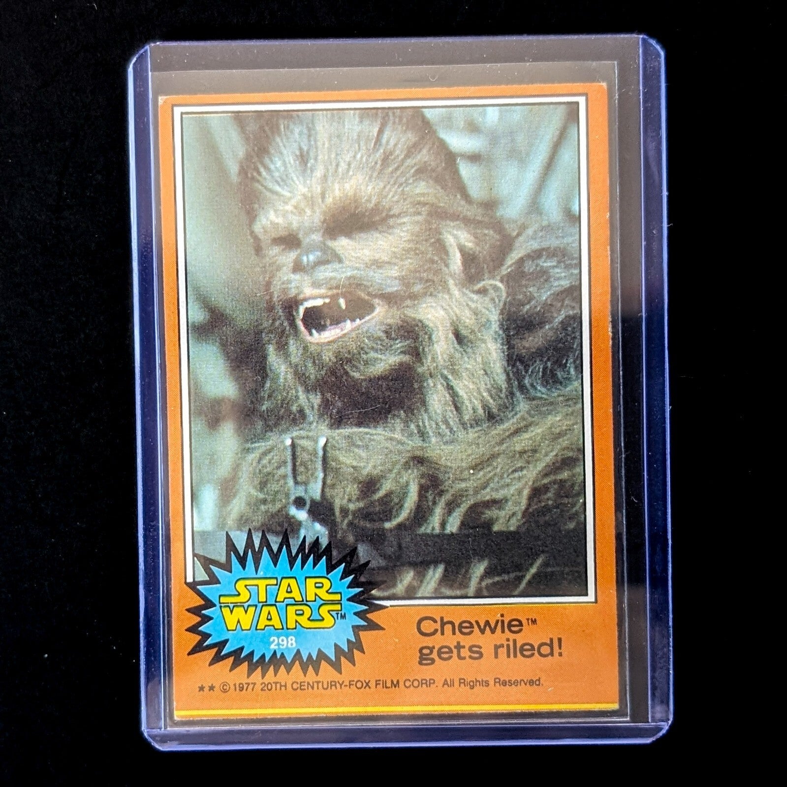 1977 TOPPS Star Wars Orange Series 4 Chewie trading card in protective sleeve by Go Figment