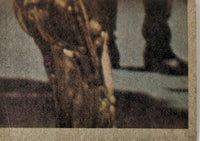 Close-up of vintage 1977 Topps Star Wars yellow Series 3 trading card corner with blurred character details