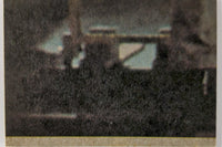 Vintage blurry 1977 Topps Star Wars yellow Series 3 trading card close-up detail