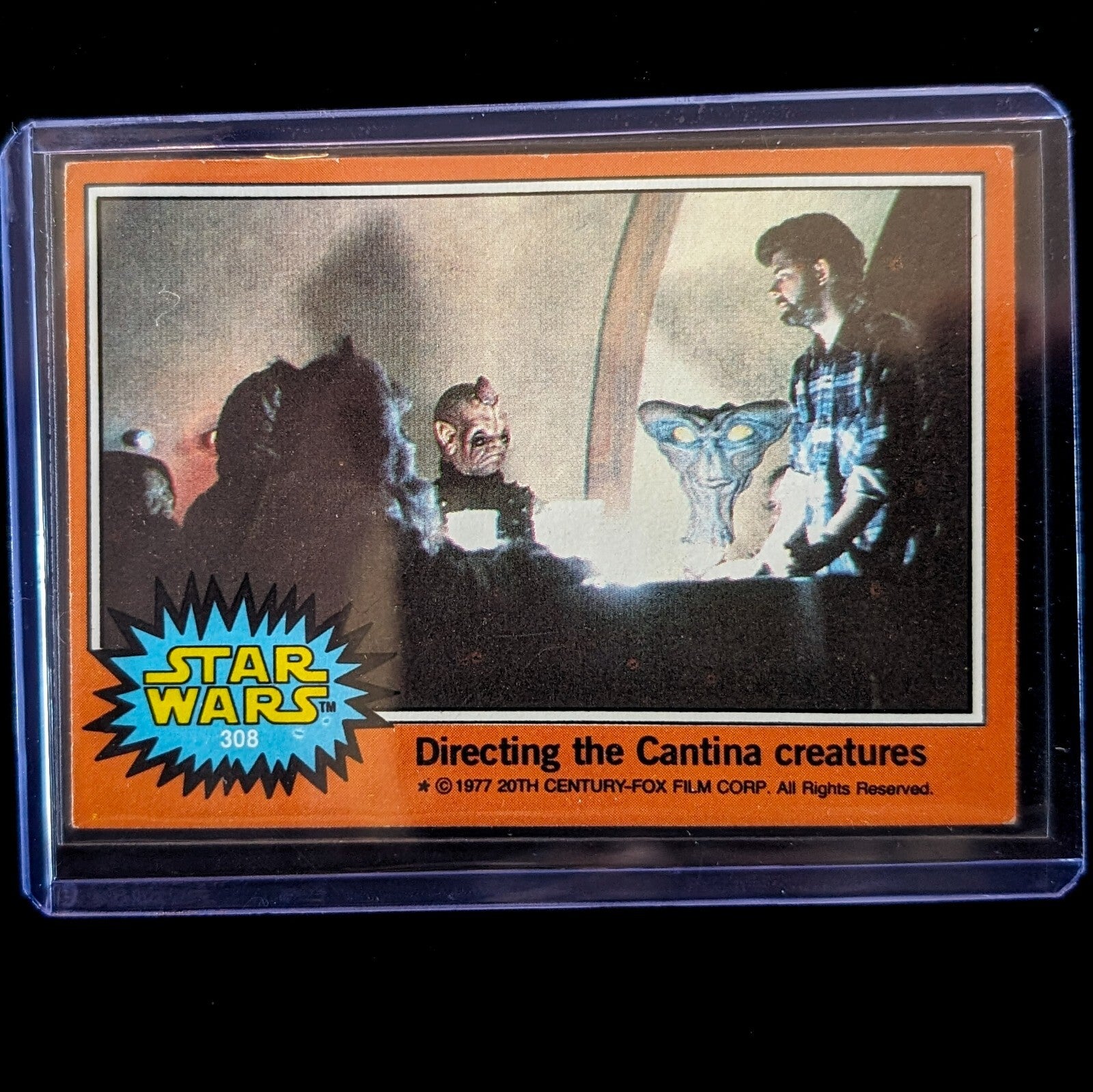 1977 TOPPS STAR WARS Orange Series 4 card showing directing the Cantina creatures by Go Figment