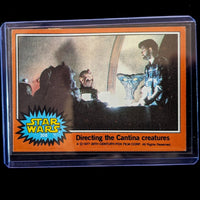 1977 TOPPS STAR WARS Orange Series 4 card showing directing the Cantina creatures by Go Figment