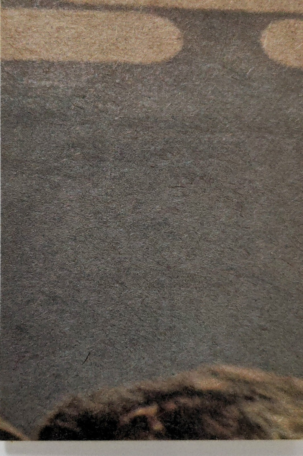 Close-up of 1977 Topps Star Wars Yellow Series 3 trading card corner on textured background